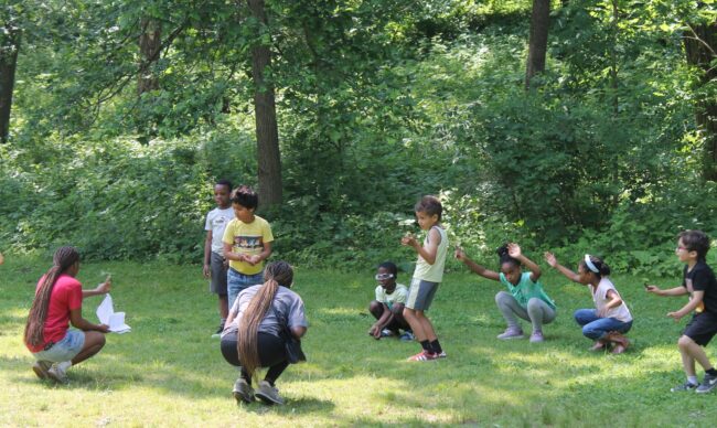 photo of nature kids campers playing a group game
