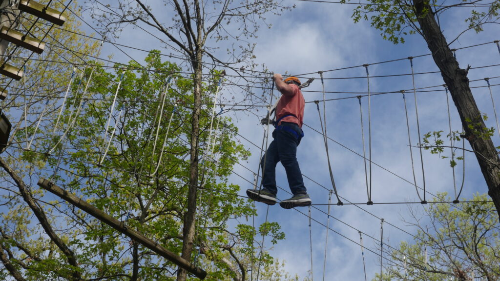 photo of participant on the high ropes course